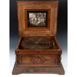 A late 19th century table top Polyphon, 11986, playing 40 cm discs, in a walnut case, some loss,