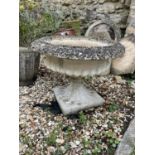 A composite stone garden planter, 66 cm diameter