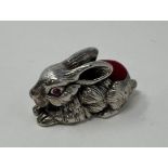A silver rabbit pin cushion This is a modern copy