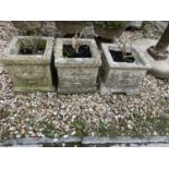 A pair of square composite stone garden planters, 28 cm wide and another (3)