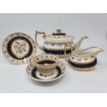 A 19th century part tea service, comprising a tea pot, cream jug, a cup, four saucers, a Royal