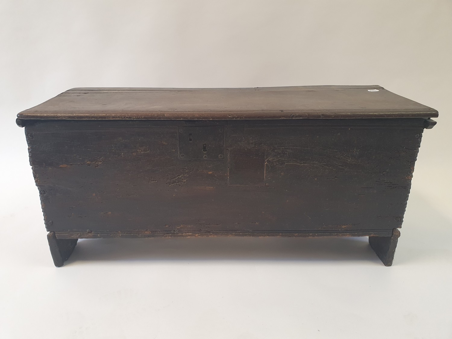 An 18th century oak coffer, 95 cm wide Top split, two large repairs, replaced hinges, various