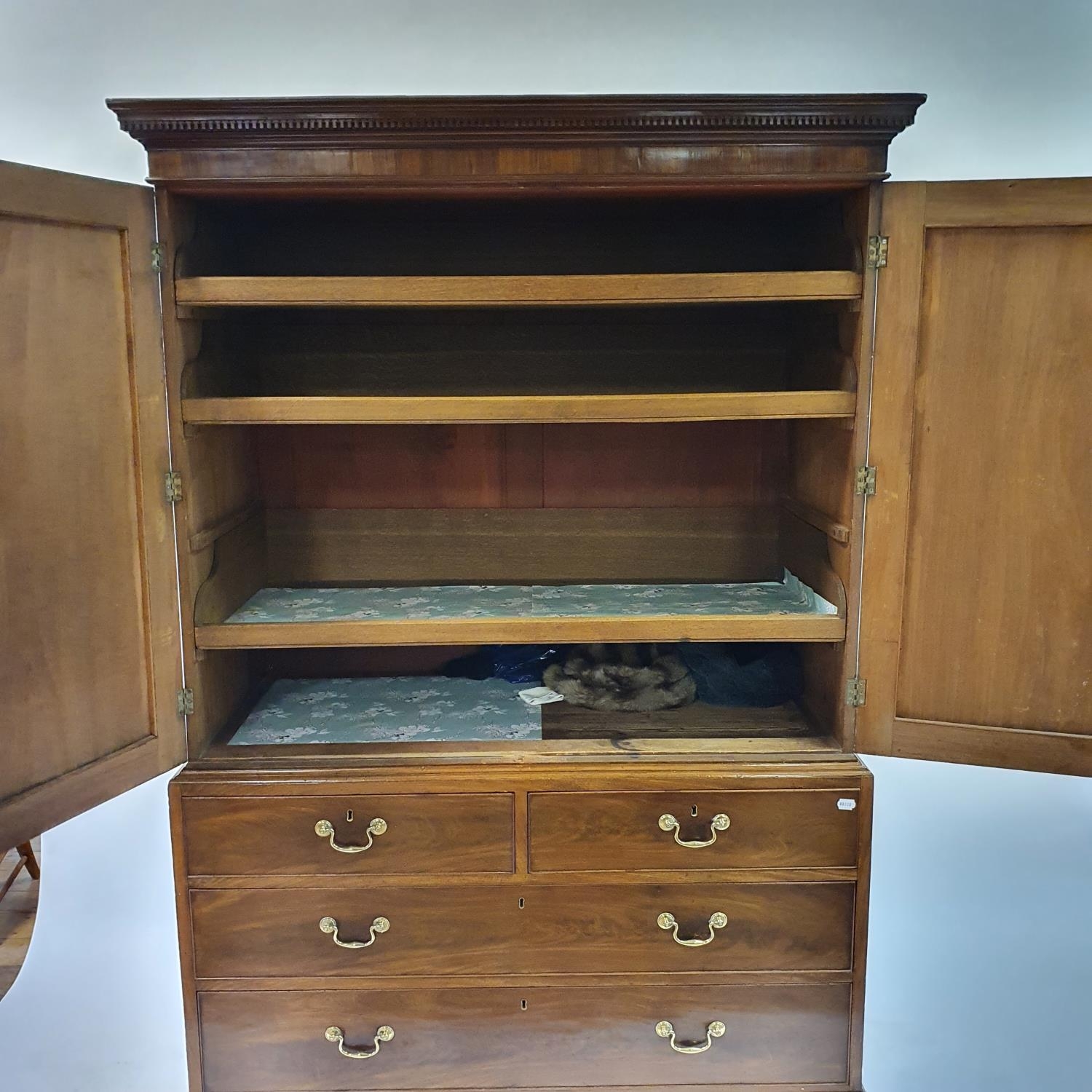 A 19th century mahogany linen press, the top with two cupboard doors, to reveal slides, on a base - Image 2 of 4