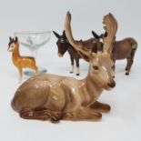 A Beswick model of a stag, 13 cm high, two Beswick donkeys, and a babycham glass (box) No chips,