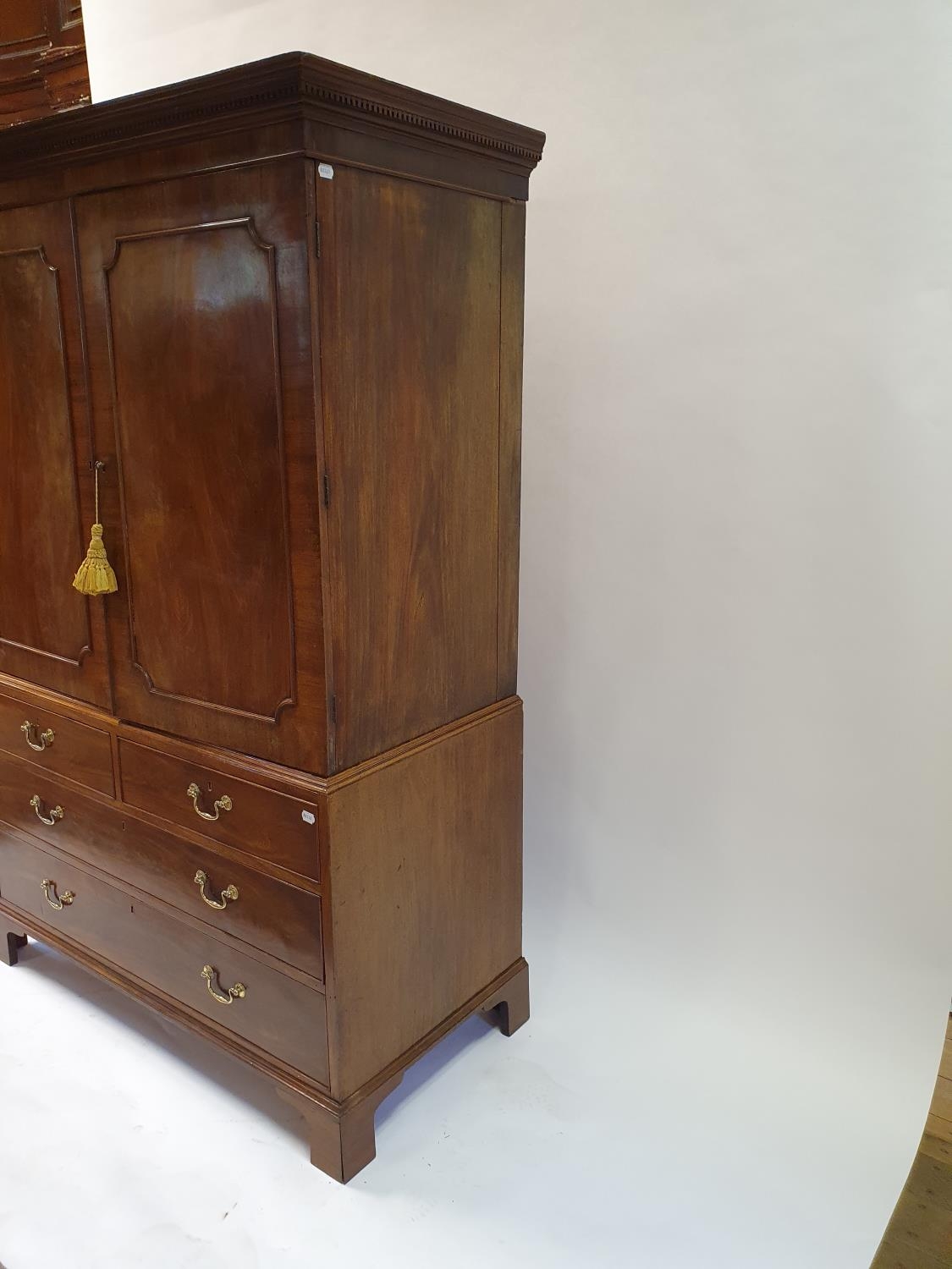 A 19th century mahogany linen press, the top with two cupboard doors, to reveal slides, on a base - Image 4 of 4