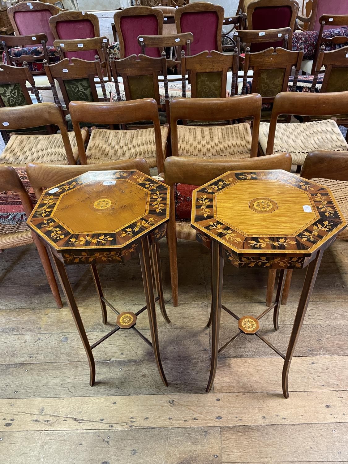 A pair of satinwood and coromandel octagonal tables, marquetry decorated with vine leaves, on