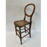 An early 20th century deportment chair