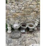 A pair of composite garden planters, 46 cm diameter, another, two garden statues and a boot