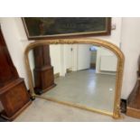 A 19th century style over mantel mirror.115 x 177 cm