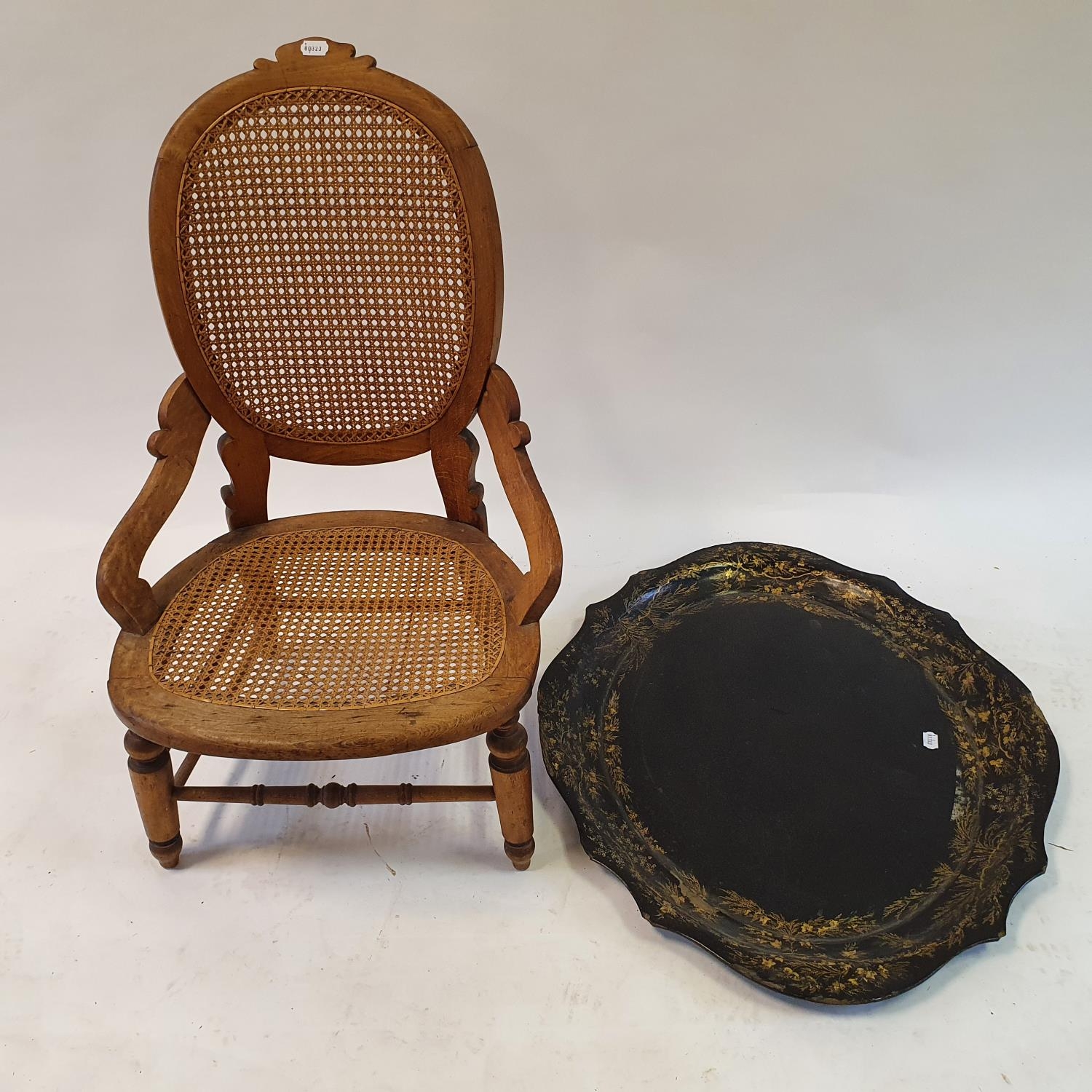 A 19th century oval lacquered tray, highlighted in gilt, and a walnut armchair (2) Tray very worn,