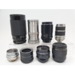 A Tamron camera lens, and ten other lenses (box)