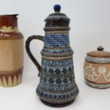 A Doulton Lambeth jug and cover, decorated foliate forms, 26 cm high, a tobacco jar, 16 cm high, a