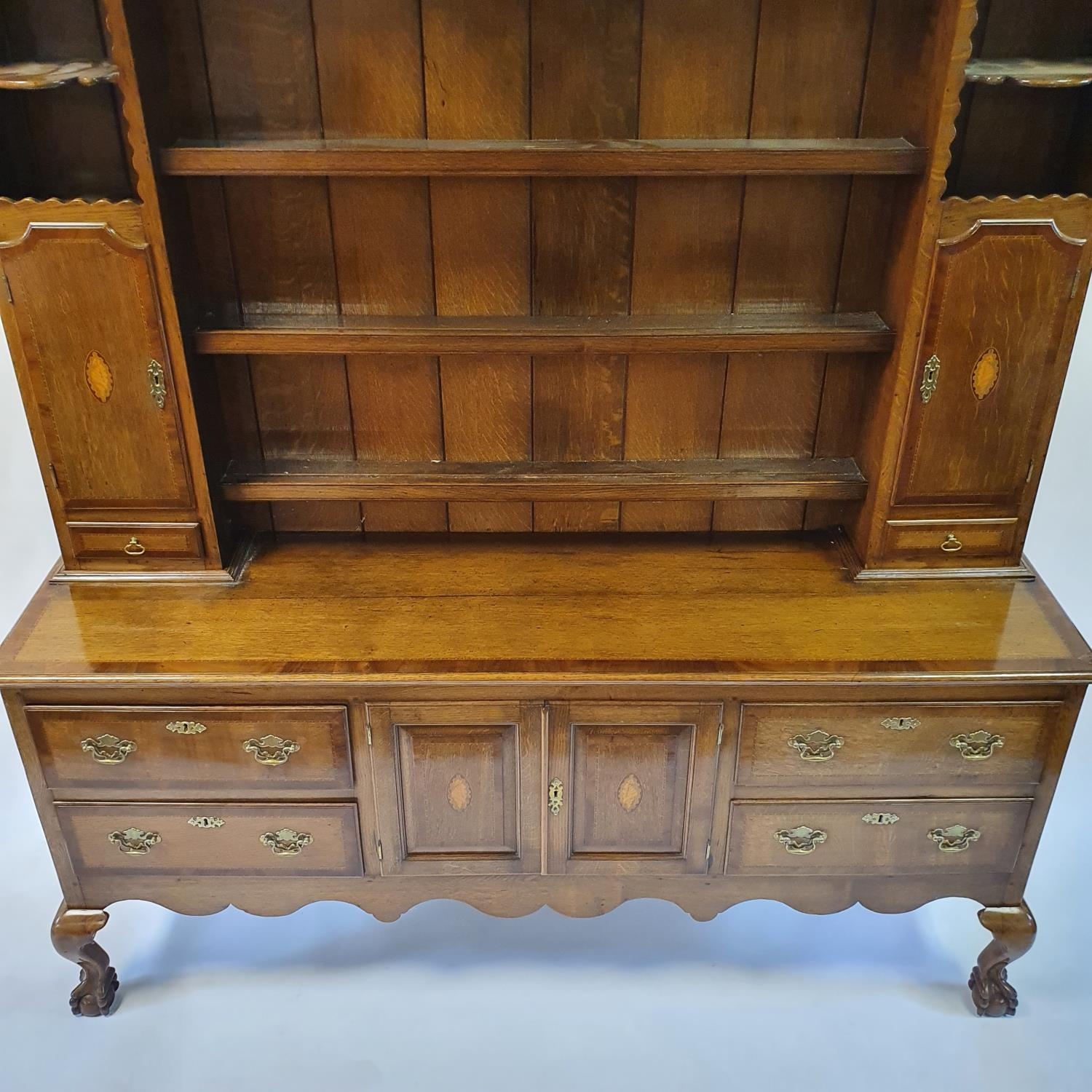An 18th century style oak dresser, the top with shelves, two cupboard doors and two drawers, the - Image 2 of 8