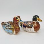 A Royal Crown Derby paperweight, in the from of a duck, its pair, a Royal Doulton Flambe vase and