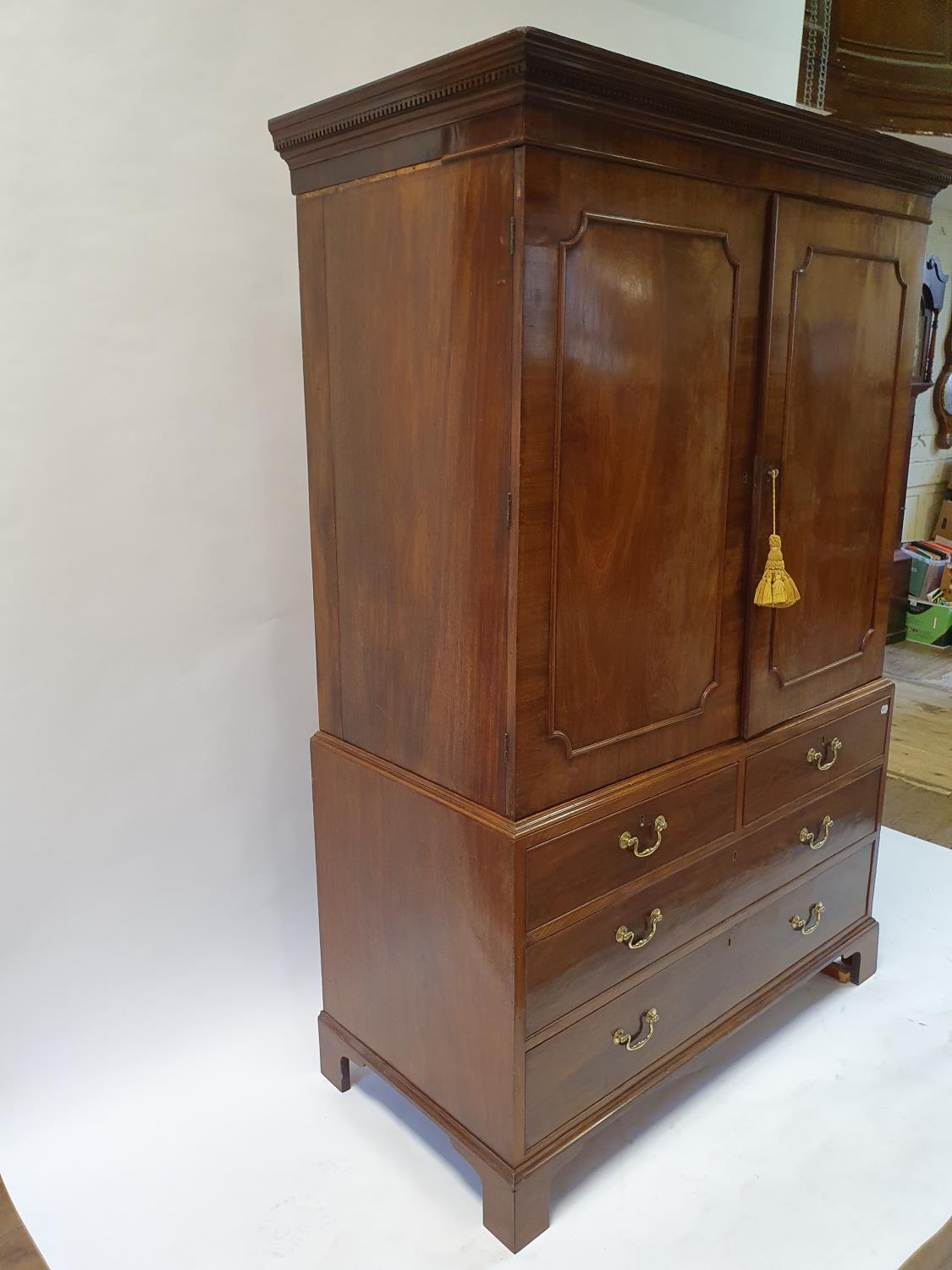 A 19th century mahogany linen press, the top with two cupboard doors, to reveal slides, on a base - Image 3 of 4