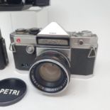 A Petri Penta camera in leather case, A Zenit EM camera in leather case and a Zeiss Ikon Nettar