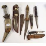 A middle-eastern style dagger, 31 cm and four other knifes, (5)