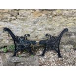 A pair of cast metal bench ends, 79 cm high (2)