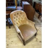 A 19th century mahogany button back armchair