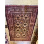 A Persian red ground rug, 220 x 133 cm and a red ground runner, 199 x 63 cm