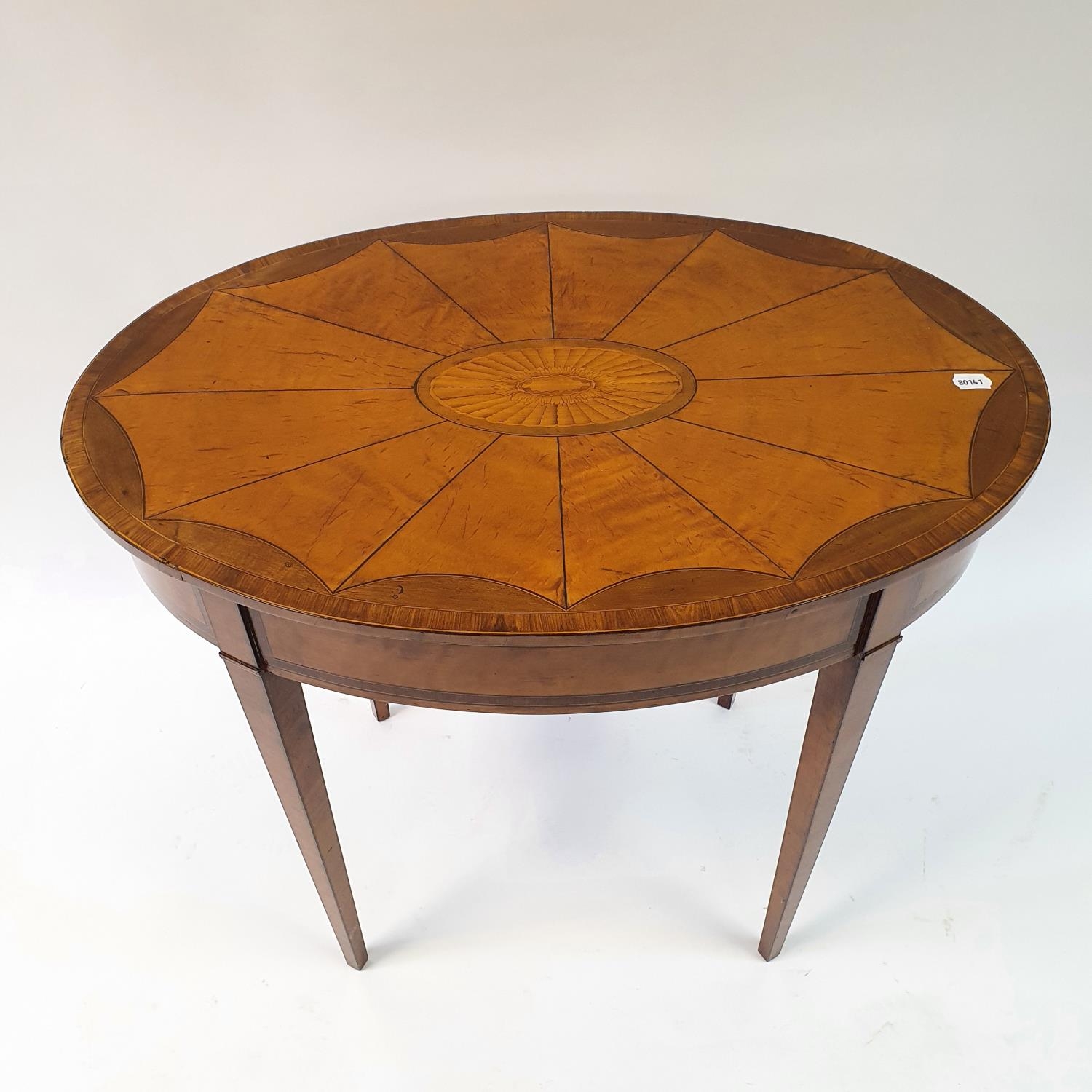 An oval table, veneered in satinwood and crossbanded in rosewood, on square tapering legs, 83 cm - Image 2 of 4