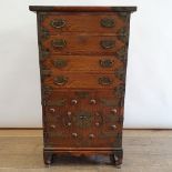 A Korean chest, having drawers and two cupboard doors, 54 cm wide 39 cm Deep 54 cm Wide 94 cm High