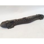 A cast iron serpentine fender, 129 cm wide