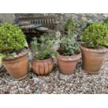 A pair of terracotta garden planters, 40 cm diameter and two other terracotta garden planters (4)