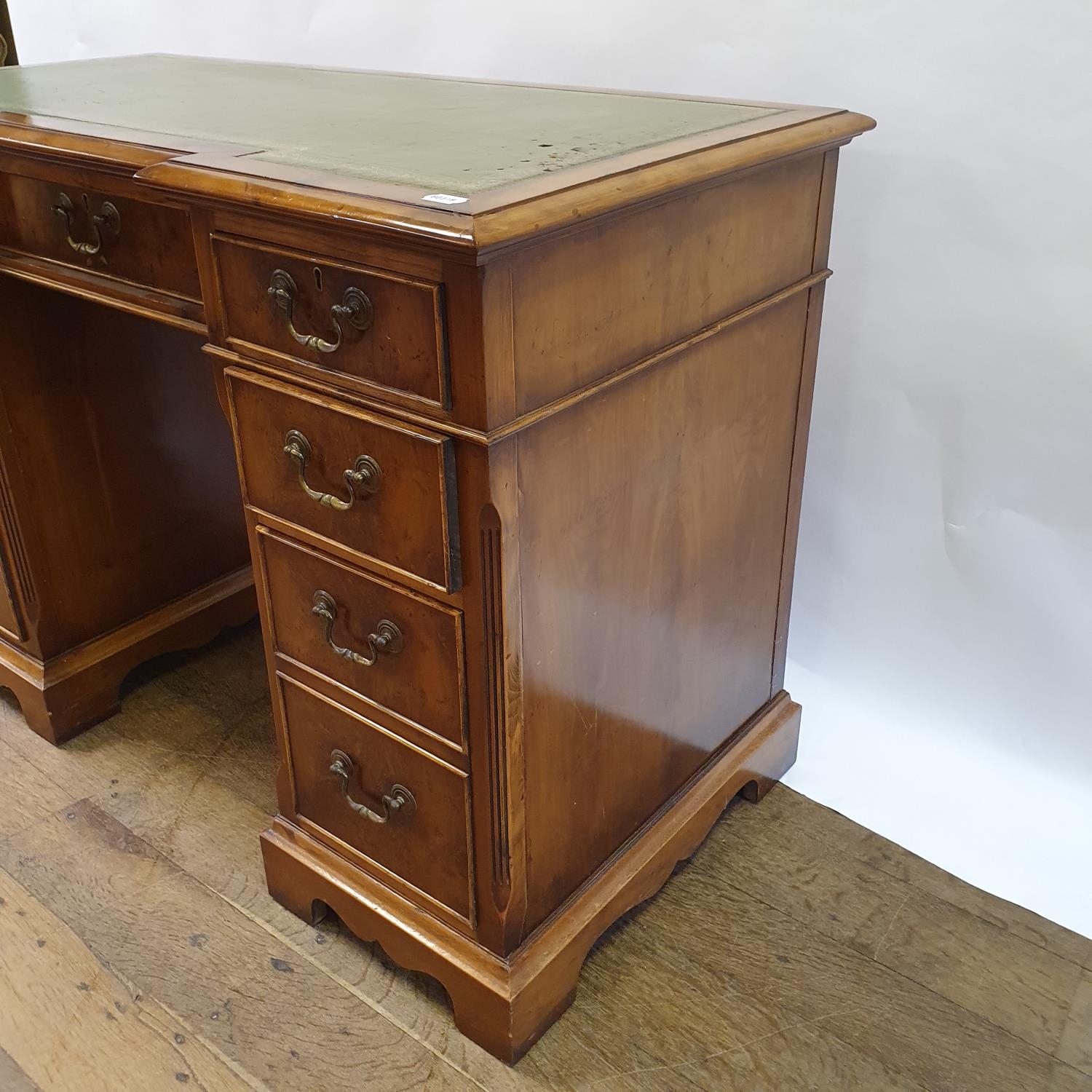 A modern walnut kneehole desk, having nine drawers, 113 cm wide Some small losses and wear to the - Image 3 of 6