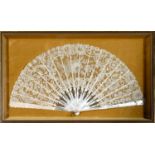 An early 20th century mother of pearl and lace fan, mounted and framed, 49 x 29 cm
