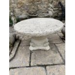 A composite stone garden pedestal, 78 cm diameter