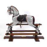 A 20th century rocking horse, with plaque reading Special Millennium Limited Edition To Mark Year