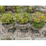 A set of three composite stone garden planters, 38 cm diameter (3)