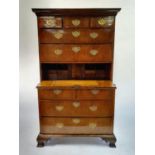 A walnut secretaire chest on chest, crossbanded and with herringbone inlay, the top having three