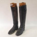 A pair of leather riding boots, with stretchers, 53 cm high Both boots heel to toe on the sole -