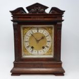 A mantel clock, the dial with Roman numerals, having a twin train movement, in walnut case, 24 cm