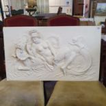 A plaster moulding in classical style of a nude riding a sea creature, 47 x 82 cm some losses