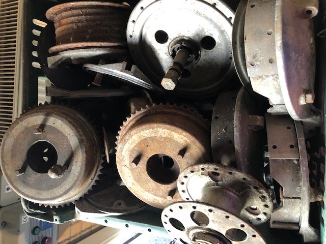Assorted Velocette spares: Wheel hubs, brake plates and shoes