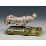 A Continental silver coloured metal fighting cockerel, on a green marbled base, 10 cm wide