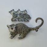 A silver and marcasite cat brooch, and another (2) This is a modern copy