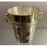 A silver plated champagne bucket, with ring handles, 20 cm high