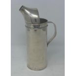 An Indian .800 standard silver coloured metal water jug, 20 cm high Stamped 800, 215 F I, 7.75 ozt