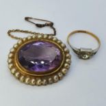 An amethyst and pearl brooch, and a yellow and white metal ring set with a white stone Brooch is