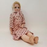 An Armand Marseille bisque head and shoulder doll, with sleeping brown eyes, and open mouth with