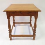 A Waring & Gillow oak table, 62 cm wide