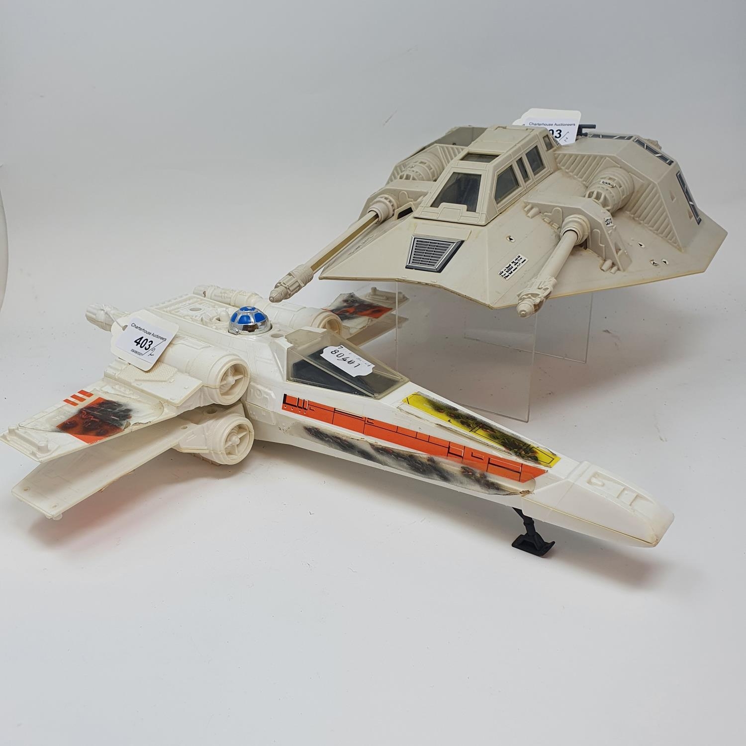 A Star Wars Hoth Snow Speeder, and an x wing (2) Snow Speeder lacking top of battery cover and
