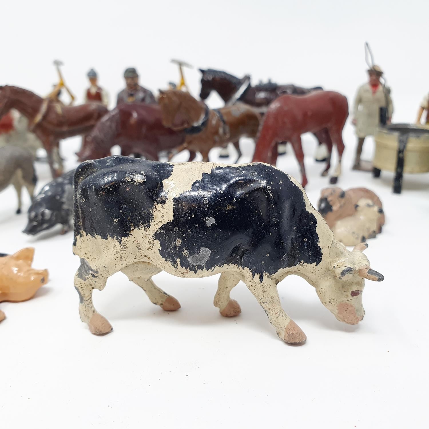 A Britains painted cow, and various other farm and other animals (qty)