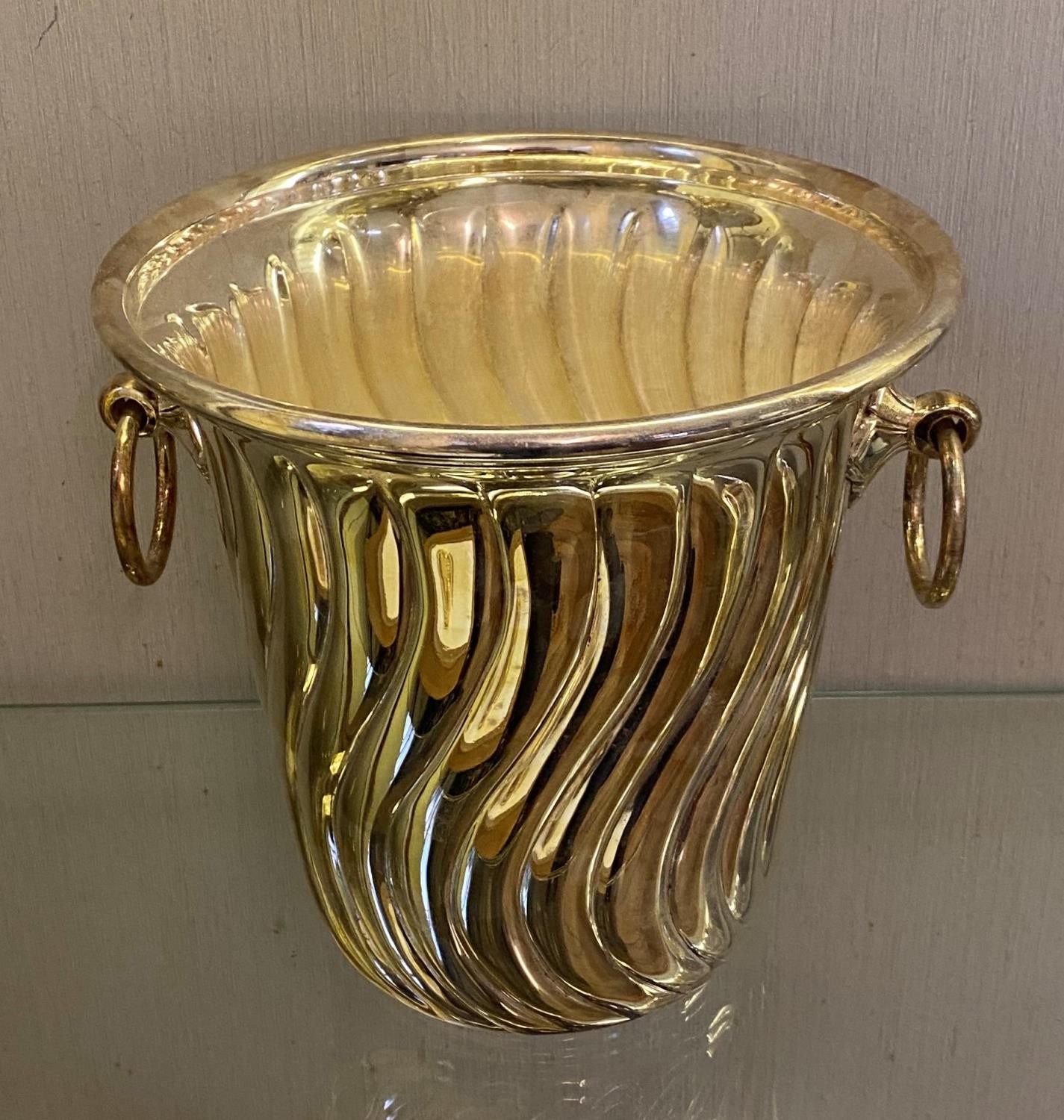 A silver plated champagne bucket, with ring handles, 21 cm high