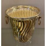 A silver plated champagne bucket, with ring handles, 21 cm high