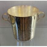 A silver plated champagne bucket, with scroll handles, 18 cm high